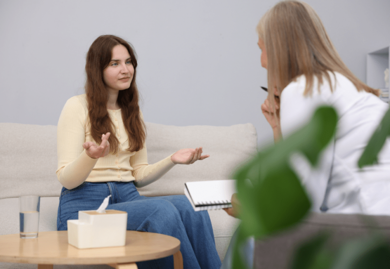 person sitting with a therapist